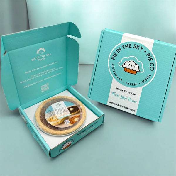 Pie in the Sky Pie Co packaging with a pie inside on a light blue background