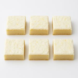 Six glazed lemon shortbread bars with lemon zest arranged in a 2x3 grid on a white background from Pie in the Sky Pie Co.